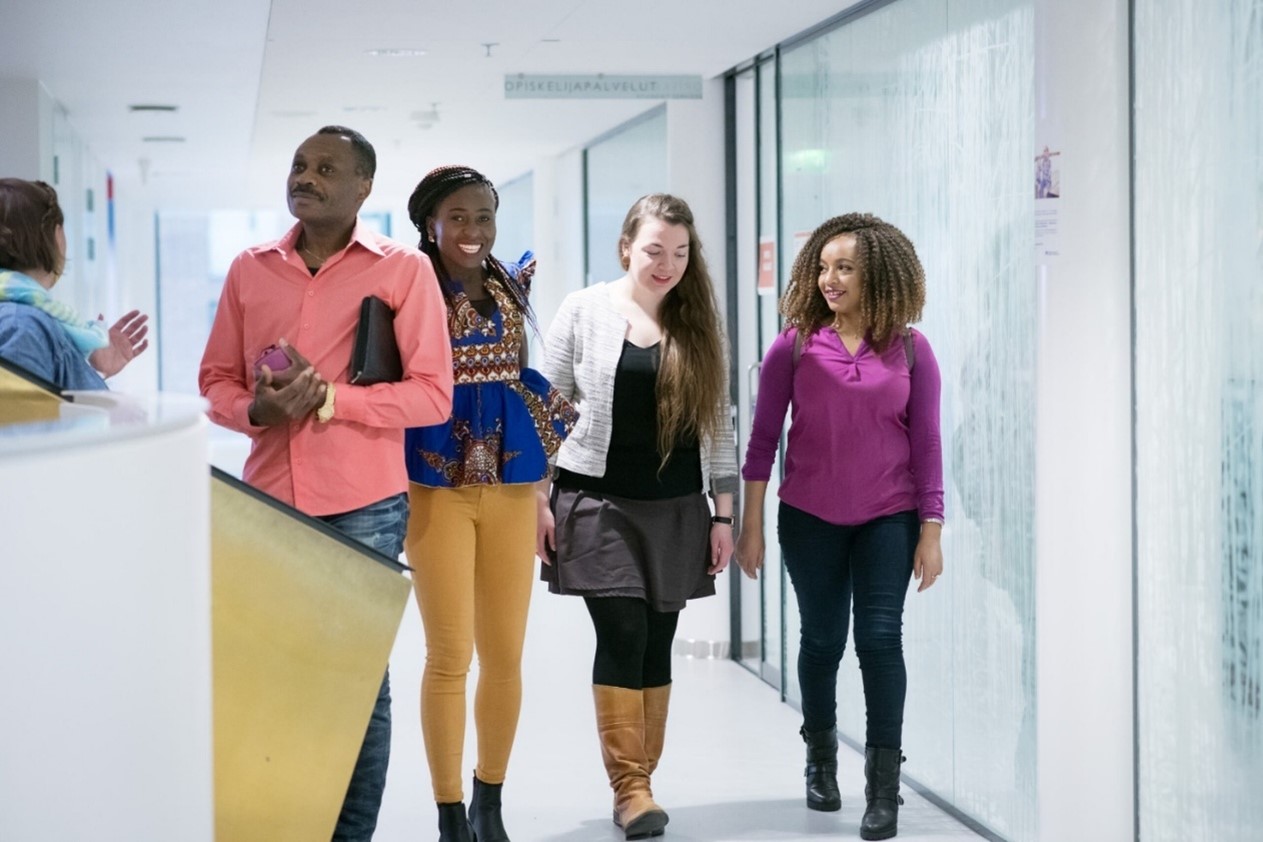 Students walking in the corridor of the educational institution.